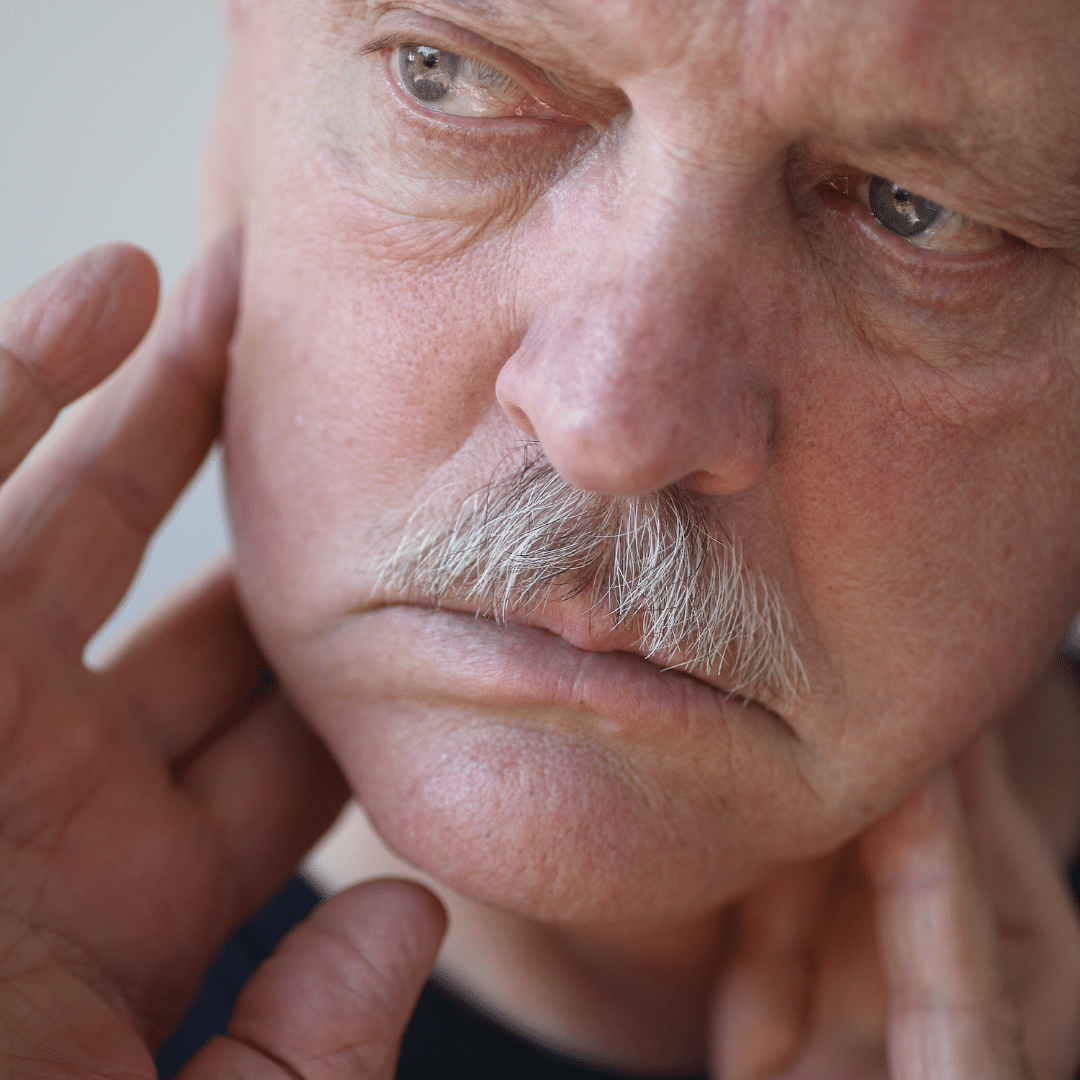 Sherman Oaks Underbite and overbite treatment patient model touching his jaw