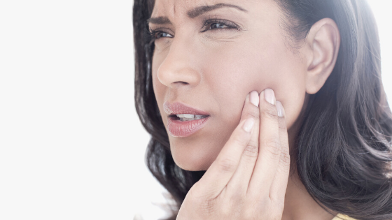 Sherman Oaks Jaw Clicking patient Model holding the side of her face