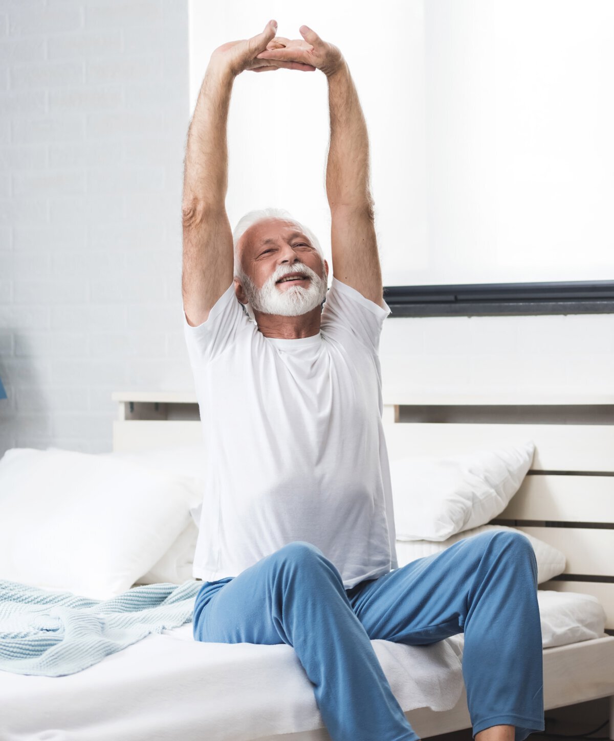 Sherman Oaks sleep therapy patient model stretching on a bed