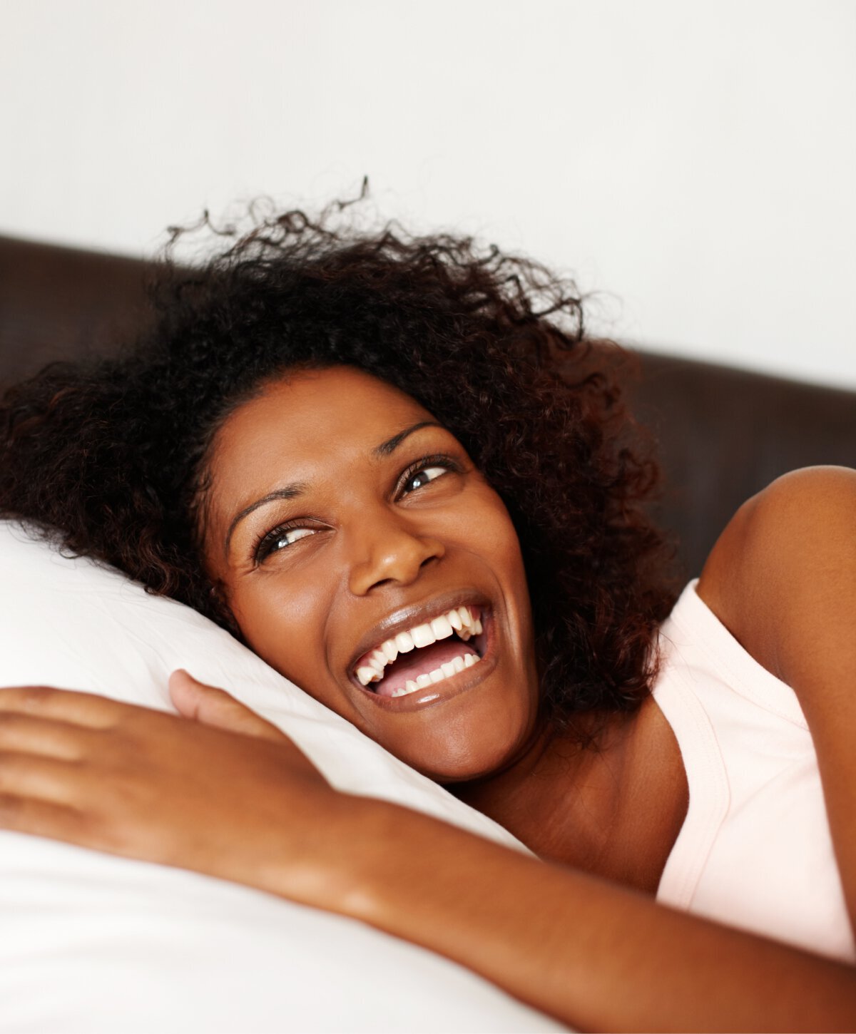 beverly hills TMJ disorder treatment patient model laughing in bed