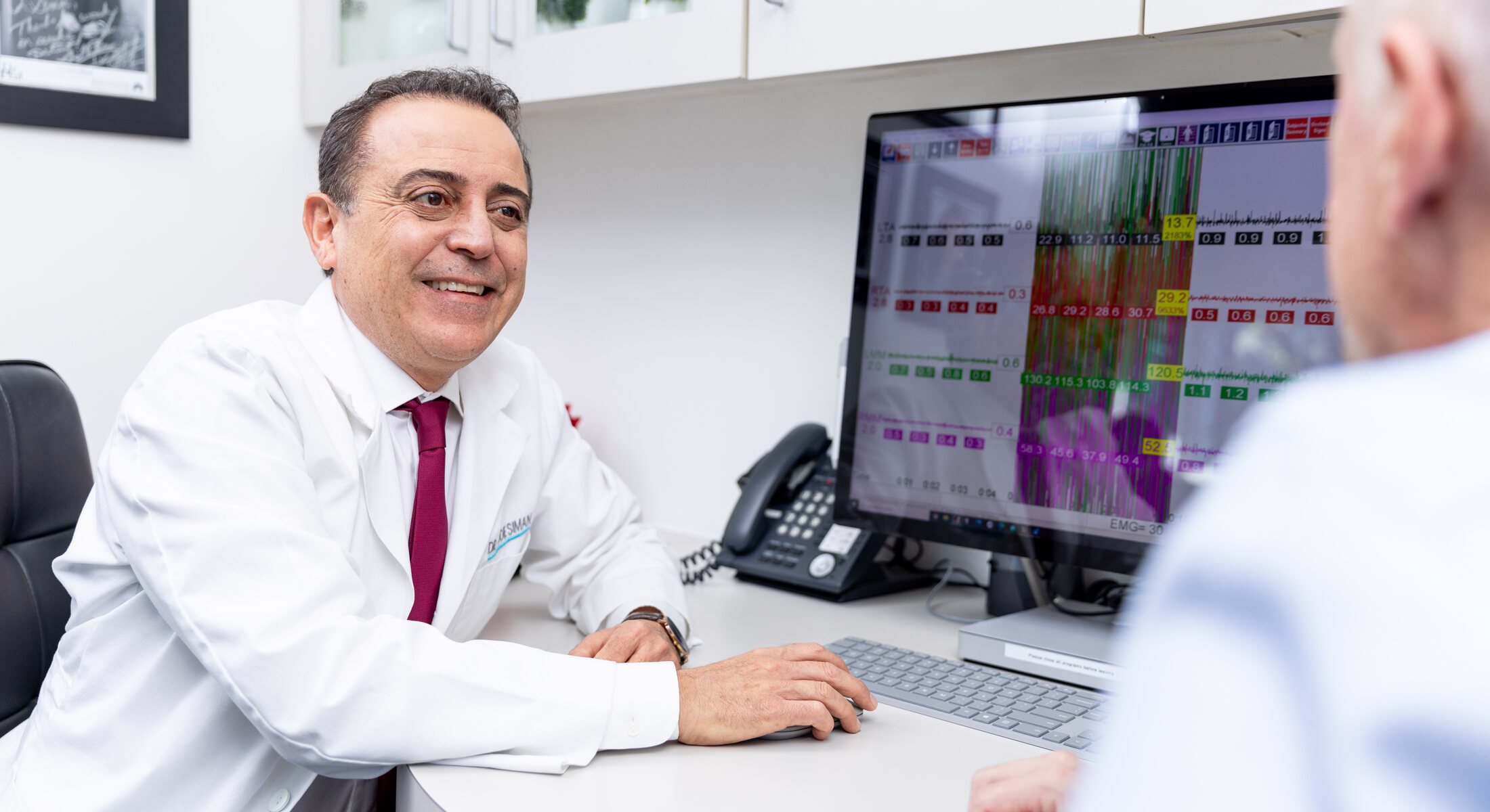 Dr. Eddie Siman consulting with a patient in his Sherman Oaks office